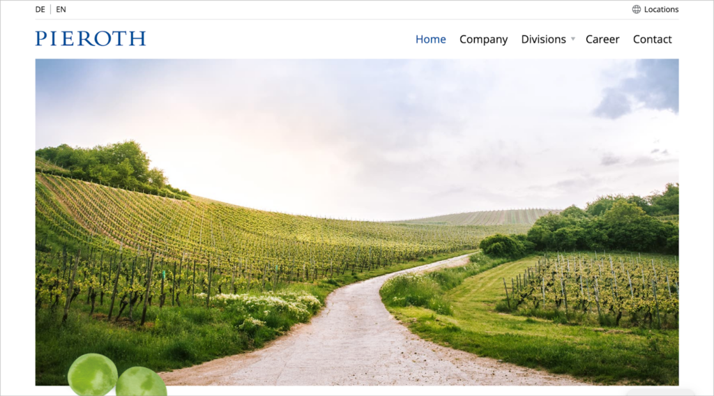 Pieroth's website homepage, showing an image of a beautiful, green vineyard
